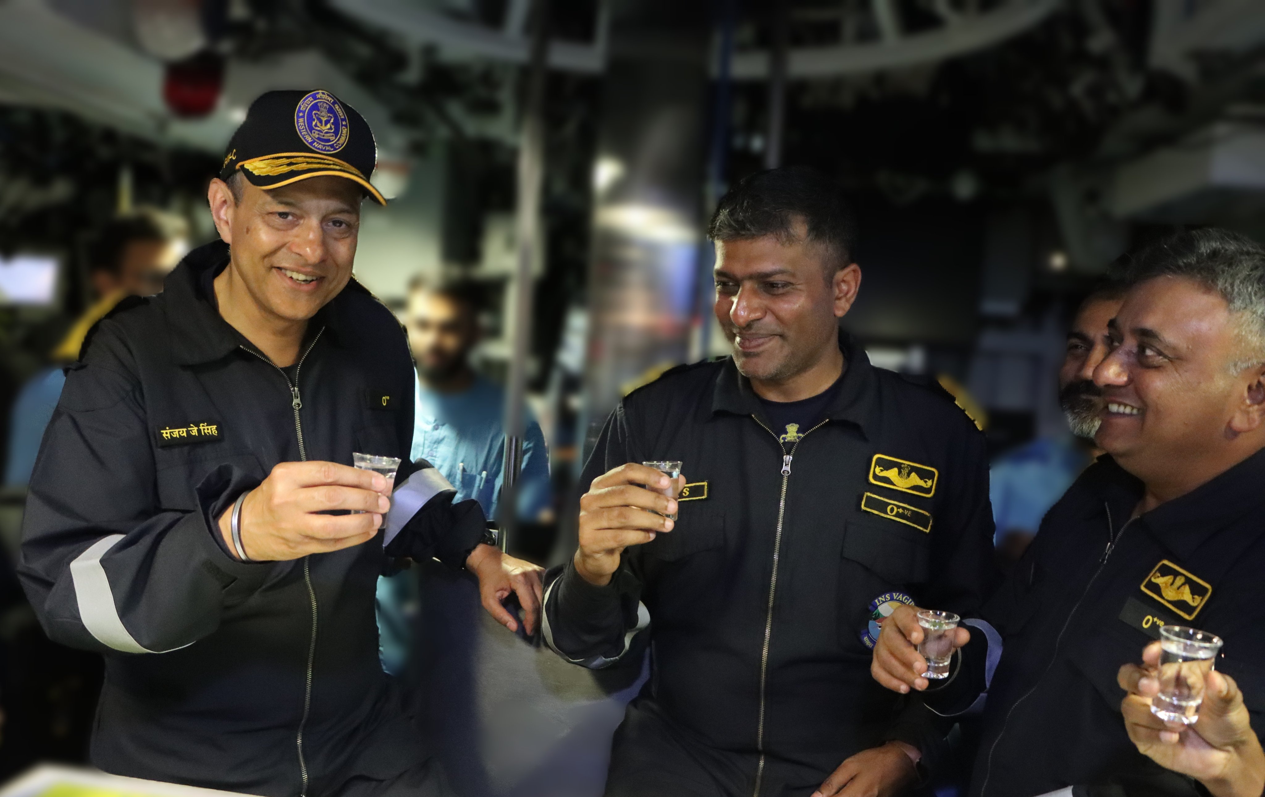 IN submariners tasting seawater as per tradition.jpeg