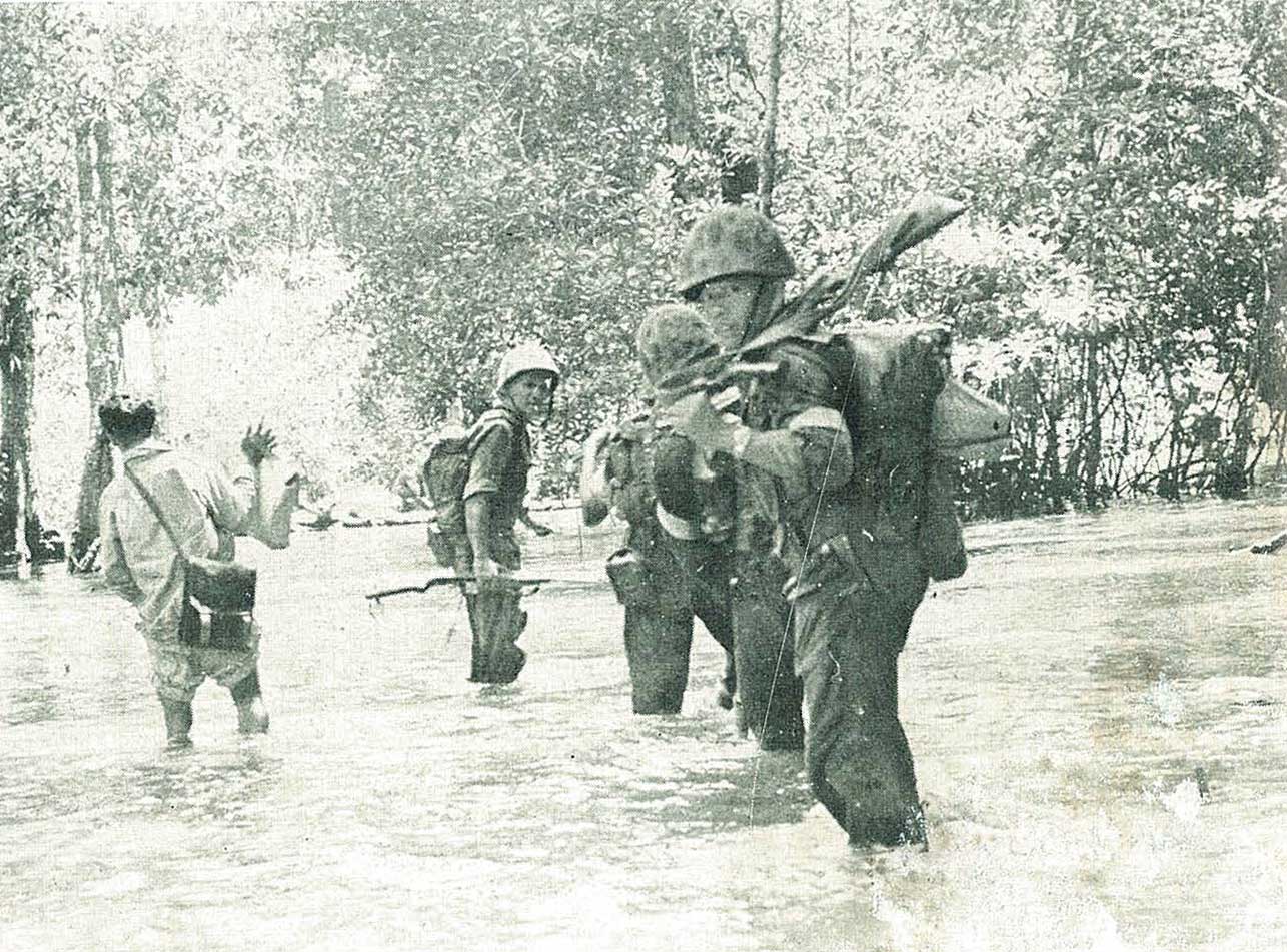 Indonesian_Navy_Commando_Corps_in_swamps_chasing_PERMESTA_troops,_Jalesveva_Jayamahe,_p154.jpg