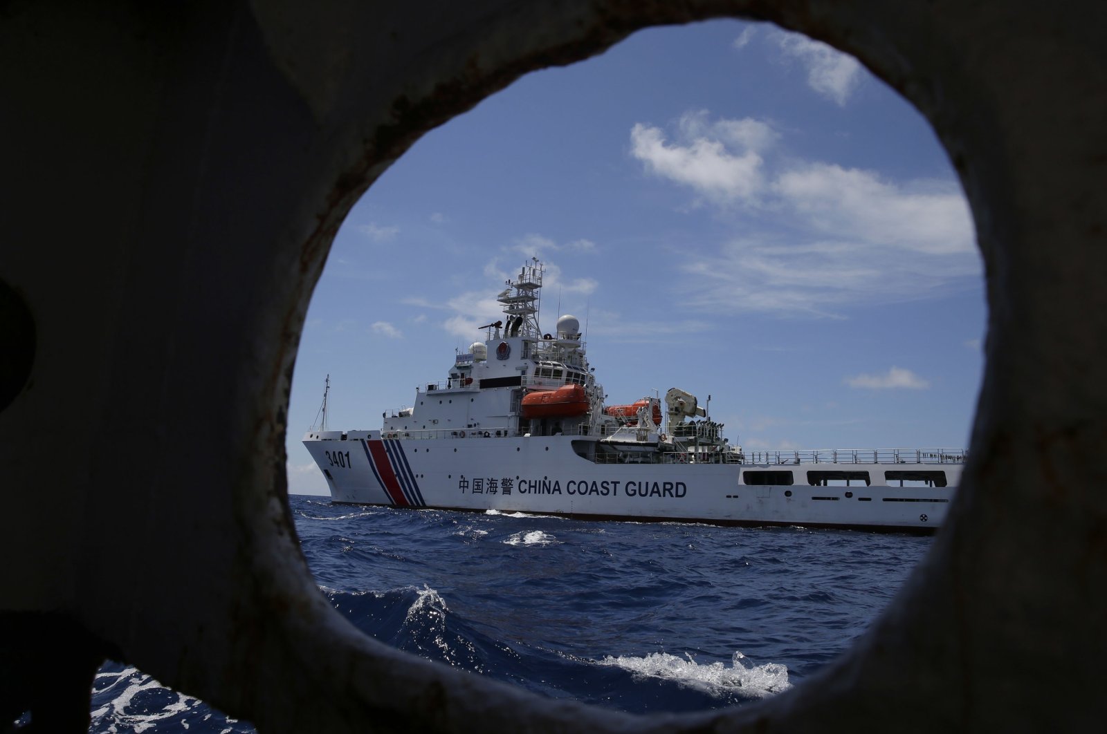 A Chinese Coast Guard ship attempts to block a Philippine government vessel as the latter tries to enter Second Thomas Shoal to relieve Philippine troops and resupply provisions, March 29, 2014. (AP Photo)