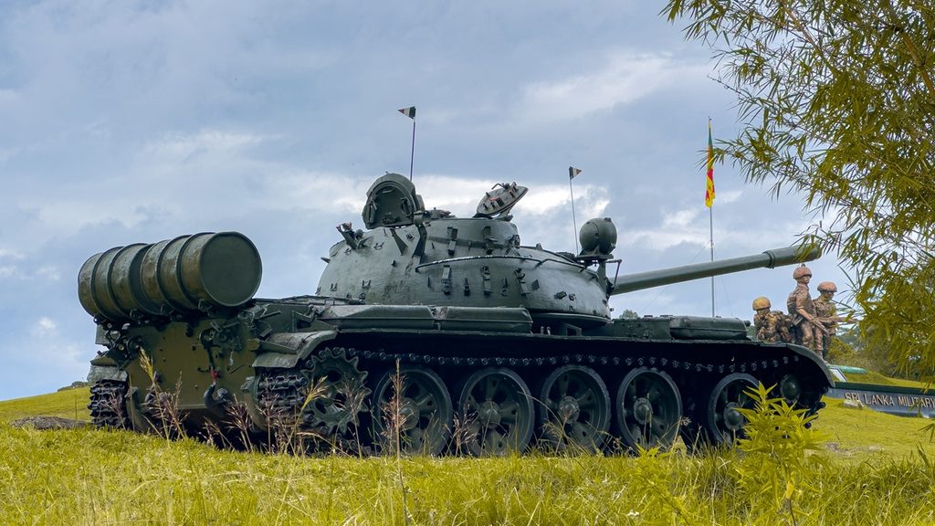 A T-54 tank on display at a war memorial.