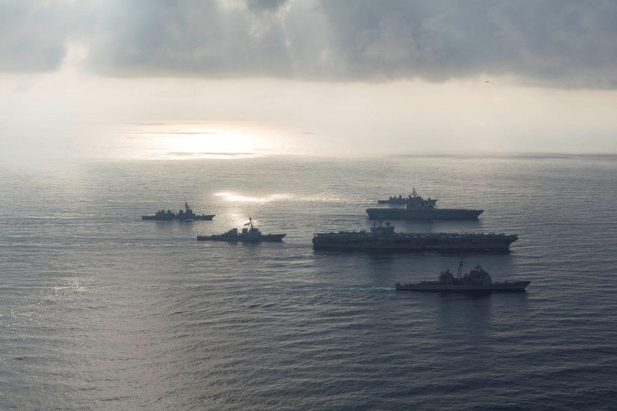 The Ronald Reagan Strike Group ship's the aircraft carrier USS Ronald Reagan (CVN 76), the guided-missile cruiser USS Antietam (CG 54) and the guided-missile destroyer USS Milius (DDG 69) conduct a photo exercise with the Japan Maritime Self-Defense Force ship's the helicopter destroyer JS Kaga (DDH 184), the destroyer JS Inazuma (DD 105) and the destroyer JS Suzutsuki (DD 117) in the South China Sea August 31, 2018. Mass Communication Specialist 3rd Class Erwin Jacob V. Miciano/U.S. Navy/Handout via REUTERS