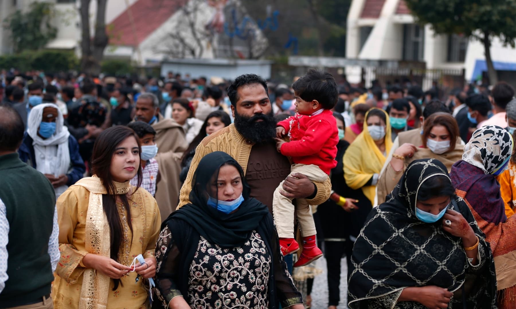 Christians leave after attending a Christmas mass in Our Lady of Fatima Church in Islamabad on Friday, Dec 25. — AP