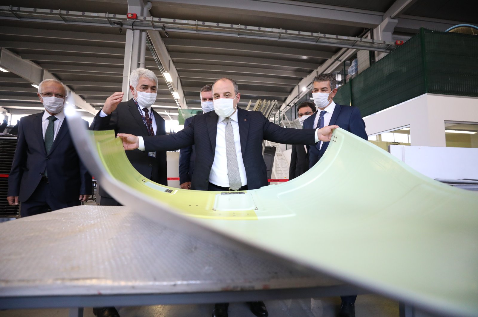 Industry and Technology Minister Mustafa Varank (C) visits a factory that conducts composite production for companies worldwide, Ankara, Turkey, Aug. 24, 2020. (AA Photo)