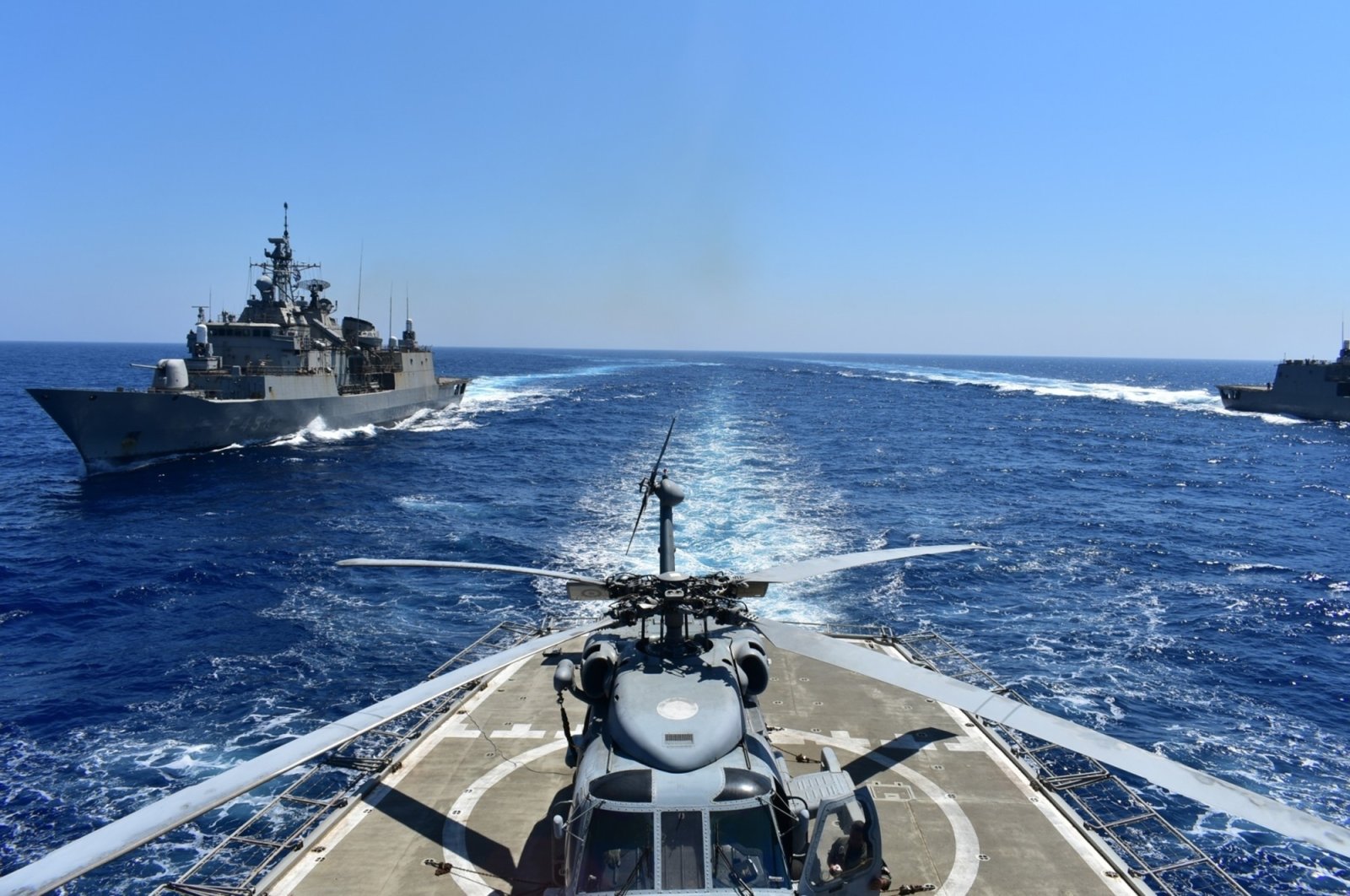 In this photo provided by the Greek Defense Ministry, warships take part in a military exercise in Eastern Mediterranean sea, Tuesday, Aug. 25, 2020. (Greek Defense Ministry via AP)