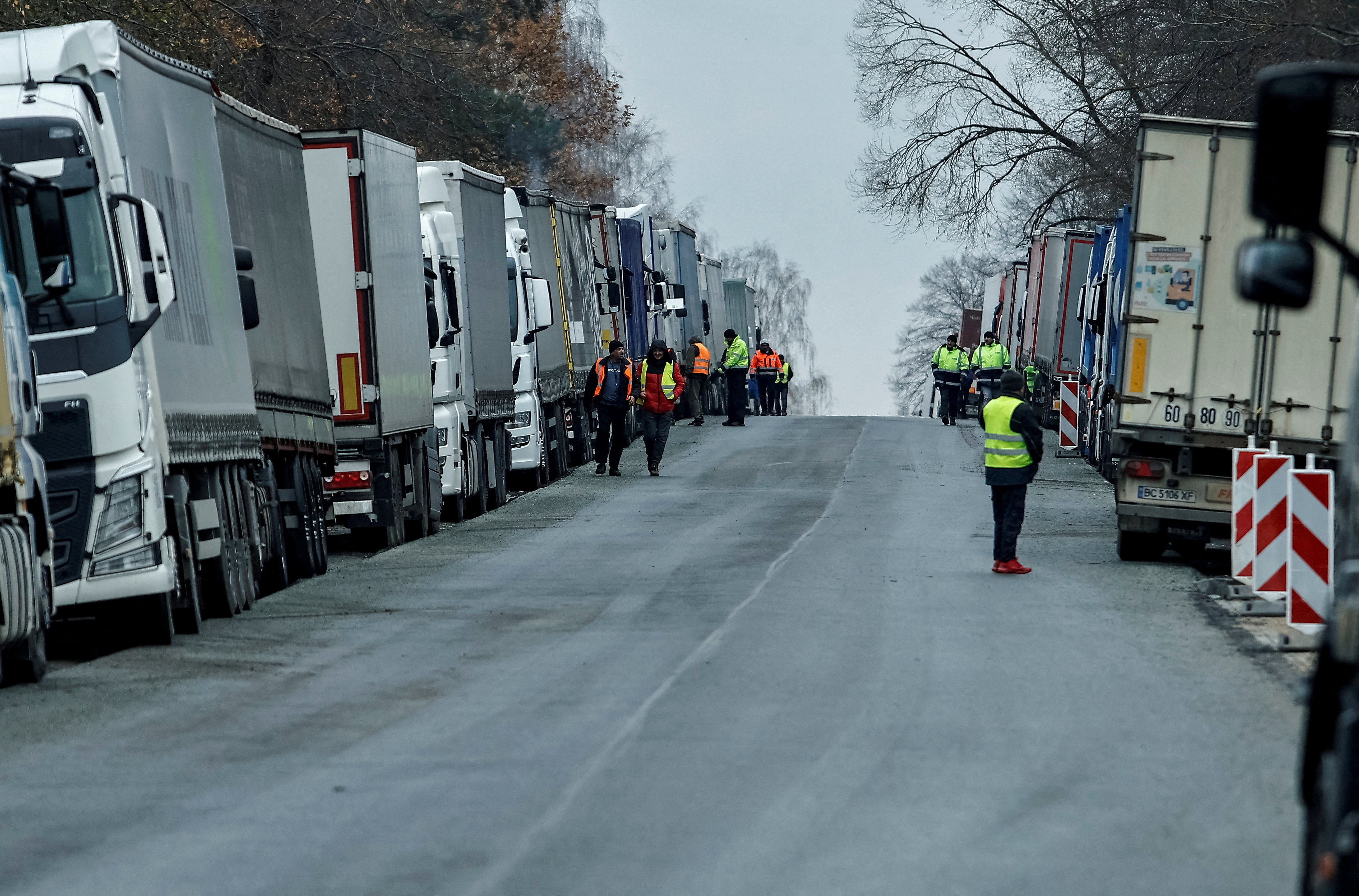 FILE PHOTO: Ukrainian trucks are parked near the Poland-Ukraine border, near the village of Korczowa, Poland