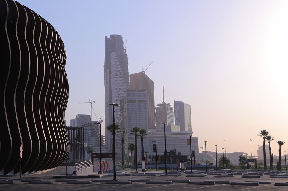 Skyscrapers stand in the King Abdullah Financial District beyond an empty parking lot in Riyadh, on July 28.