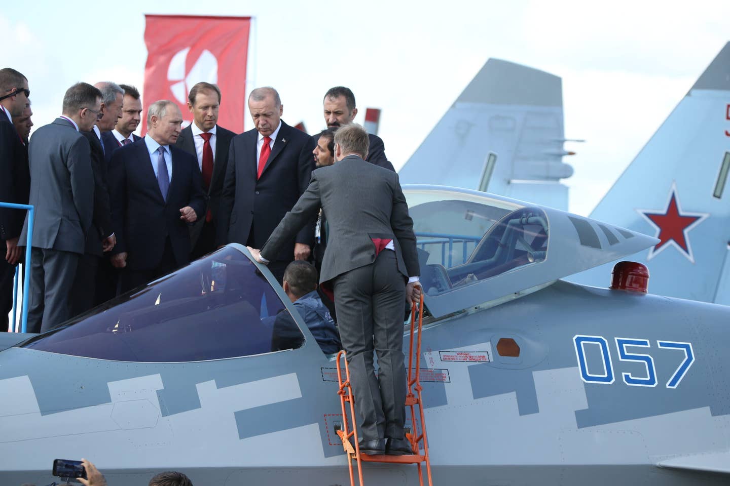Russian President Vladimir Putin (left) and Turkish President Recep Tayyip Erdogan (right) observe a Su-57 fighter while visiting the MAKS 2019 International Aviation and Space Show in Zhukovsky, outside Moscow, Russia, on August 27, 2019. <em>Photo by Mikhail Svetlov/Getty Images</em>