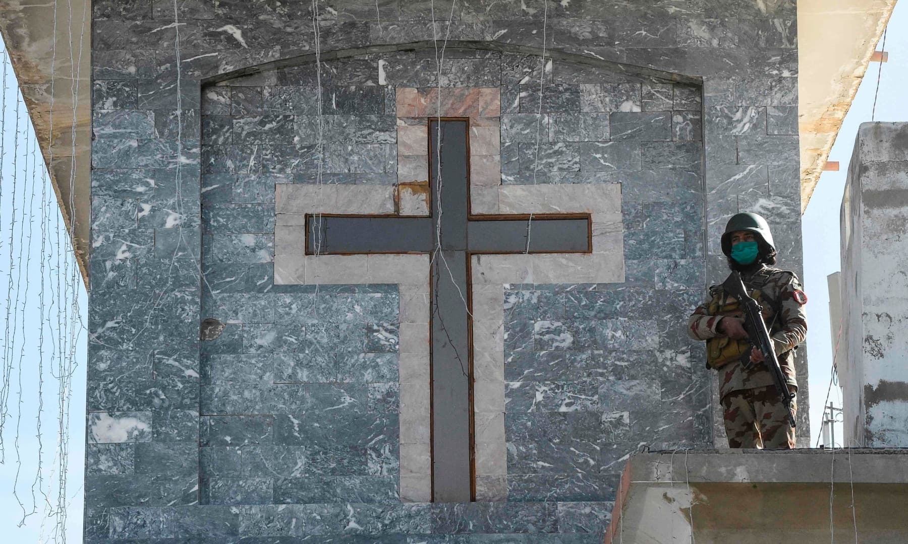 A Frontier Constabulary (FC) soldier stands guard during prayers at the Methodist church on Christmas Day, in Quetta. — AFP