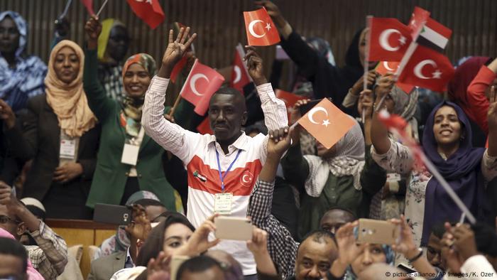 Sudanese students waving Turkish flags.