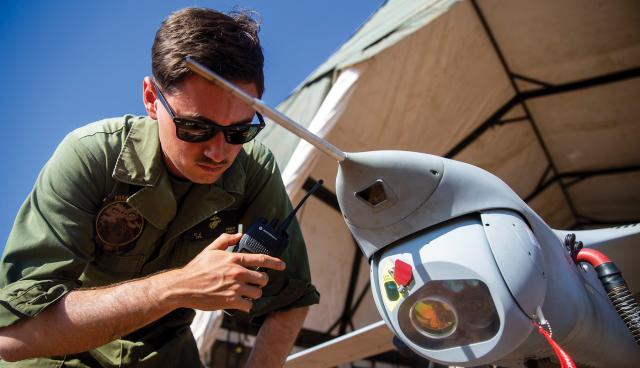 As we hone our expeditionary advanced base operations concepts and weapons, the Marine Corps will likely procure antisubmarine warfare weapons and sensors that can be deployed from unmanned vehicles and from the shore. Here, a Marine works with an unmanned aerial vehicle. 