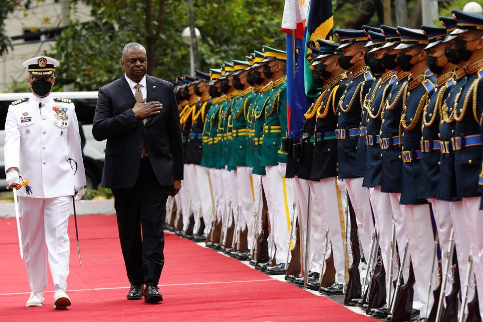 United States Defense Secretary Lloyd Austin (R) walks past military guards during arrival honors at the Department of National Defense in Camp Aguinaldo military camp on February 2, 2023 in Quezon City, Manila, Philippines.