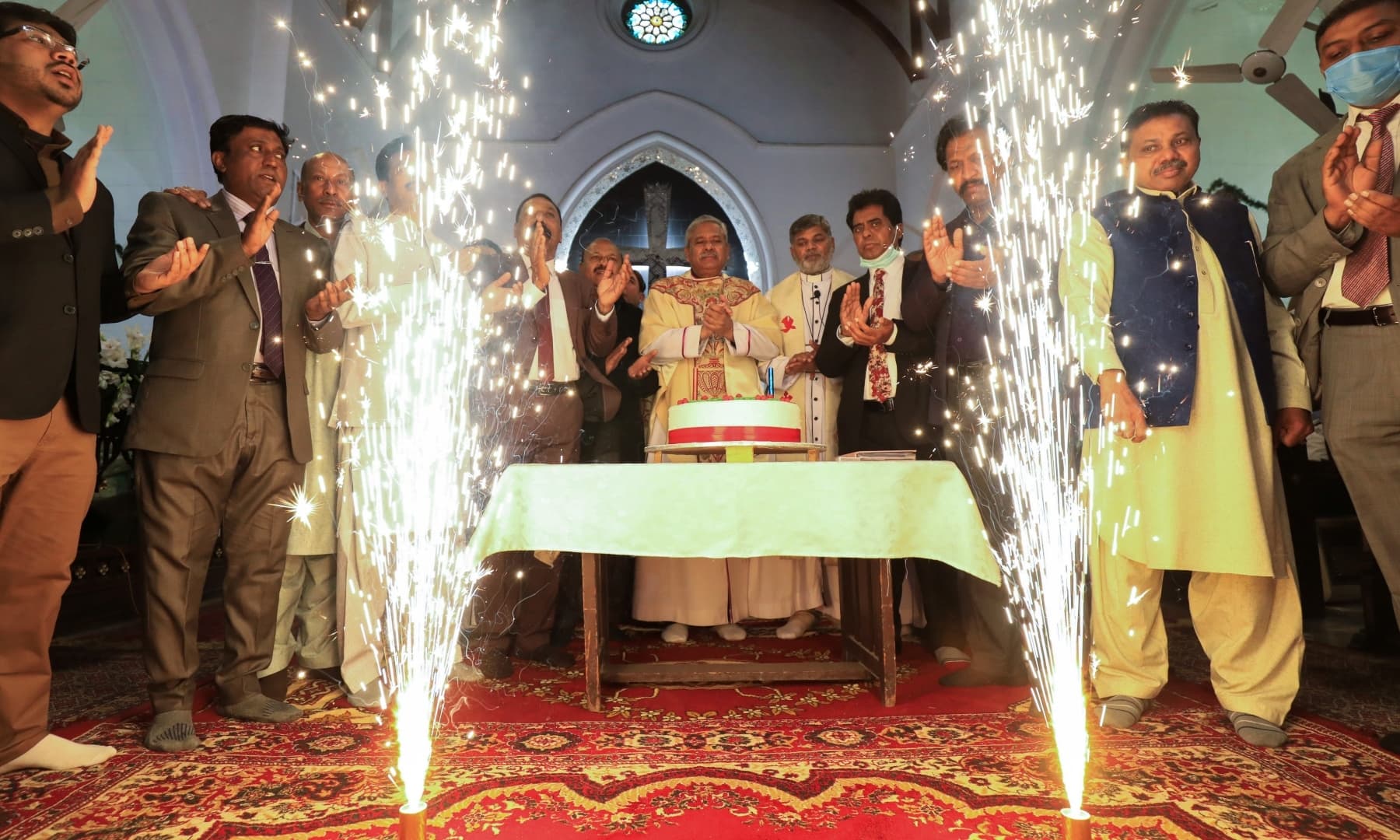 People celebrate Christmas at St. John's Cathedral in Peshawar, December 25. — Reuters