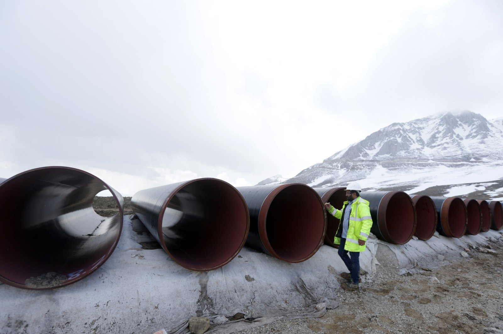 A local employee marks pipes at the nearby Marta Pass, the highest point of the Trans Adriatic Pipeline (TAP) in Korce, Albania, April 17, 2019. (Reuters Photo)