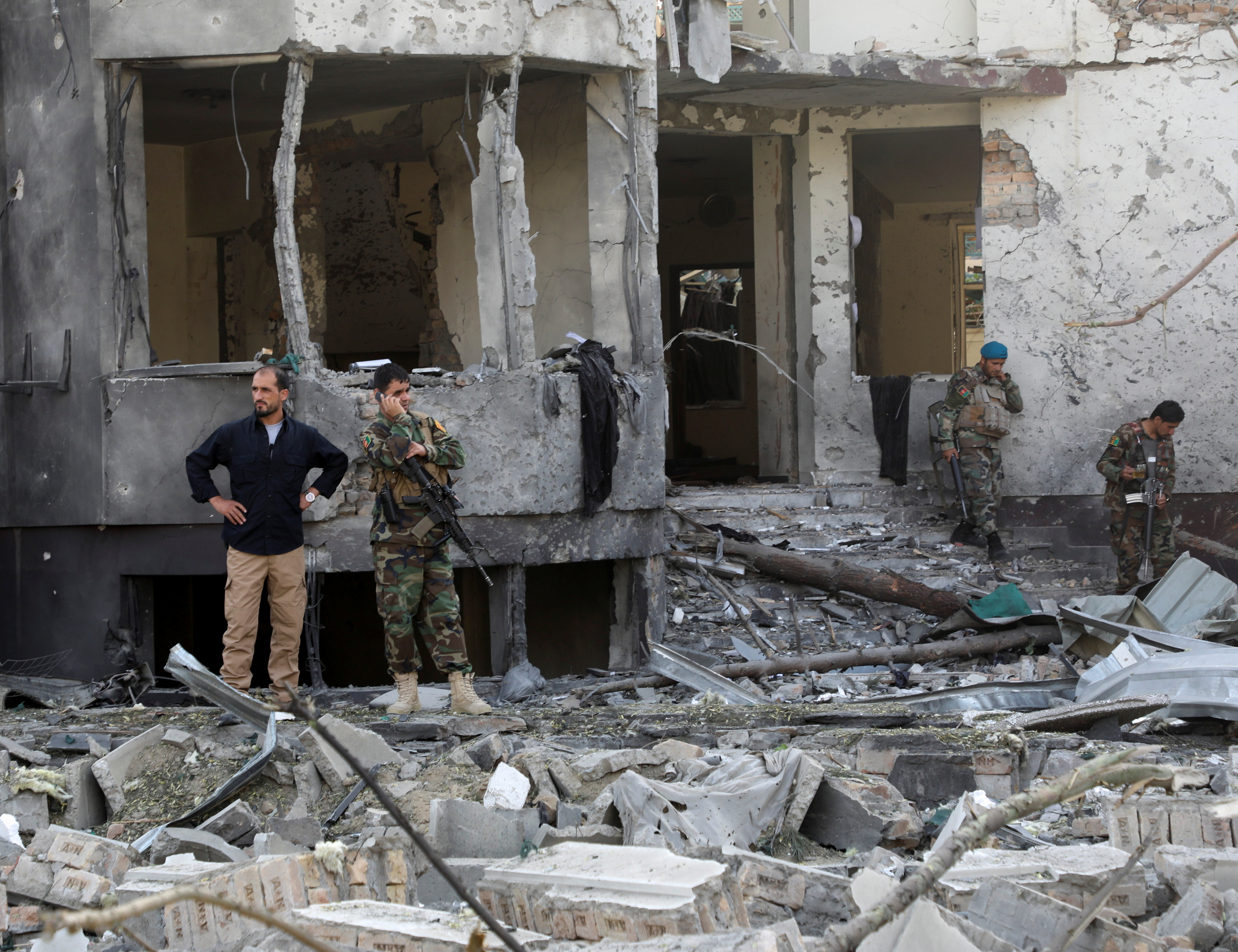 Afghan National Army (ANA) soldiers keep watch at the site of yesterday's night-time car bomb blast in Kabul, Afghanistan August 4, 2021. REUTERS/Stringer