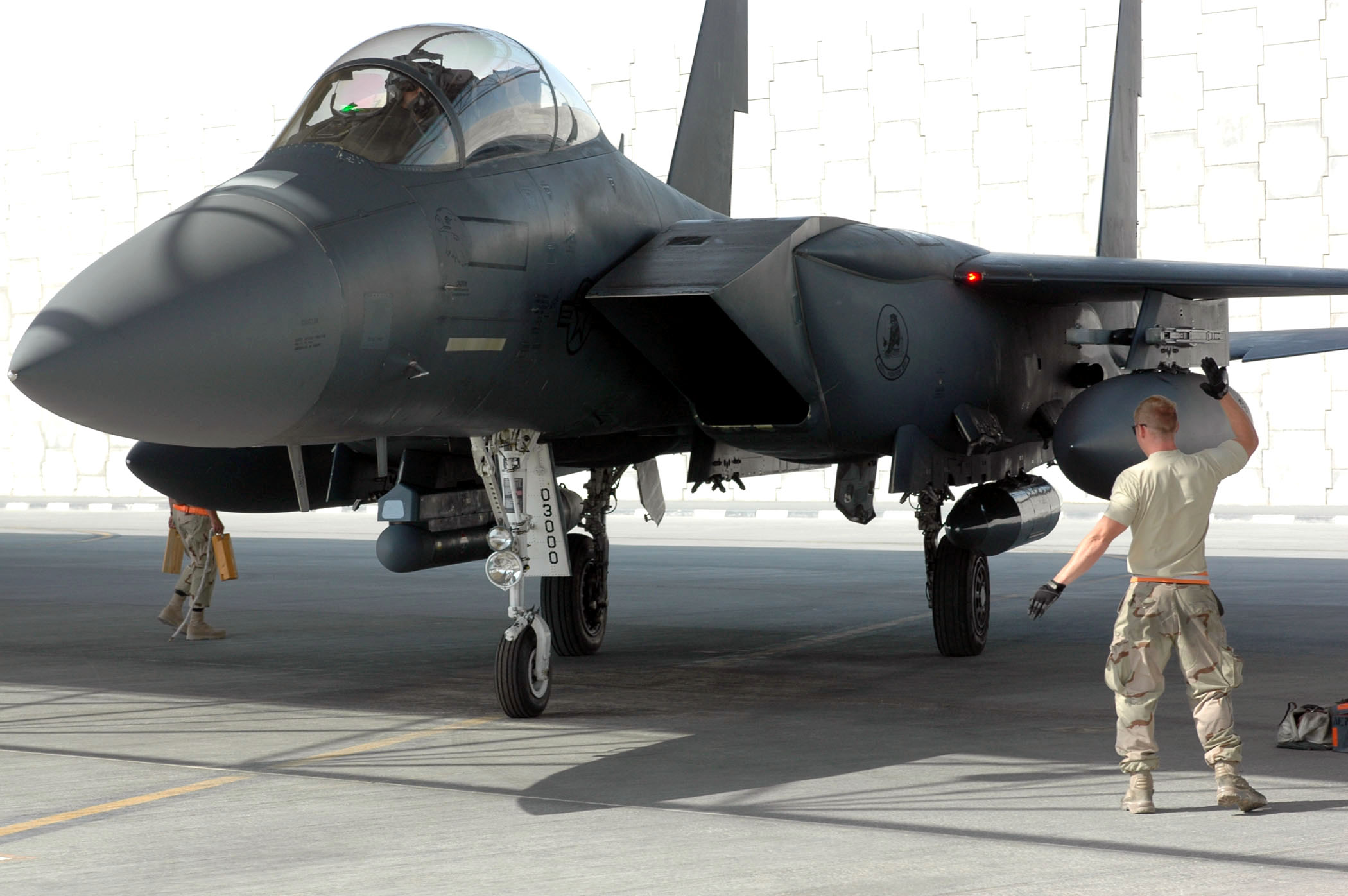 F-15E_Strike_Eagle_guided_into_position_by_a_crew_chief.jpg