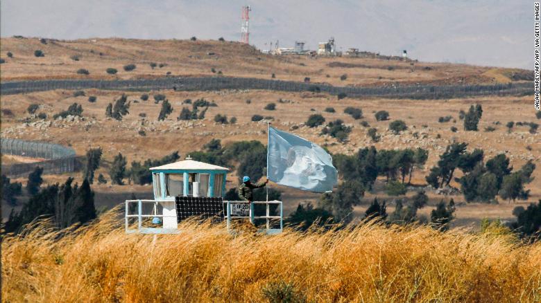 A UN peacekeeper stands on duty at an outpost of the United Nations Disengagement Observer Force (UNDOF) buffer zone between Syria and the Israeli-annexed Golan Heights on August 11, 2020.
