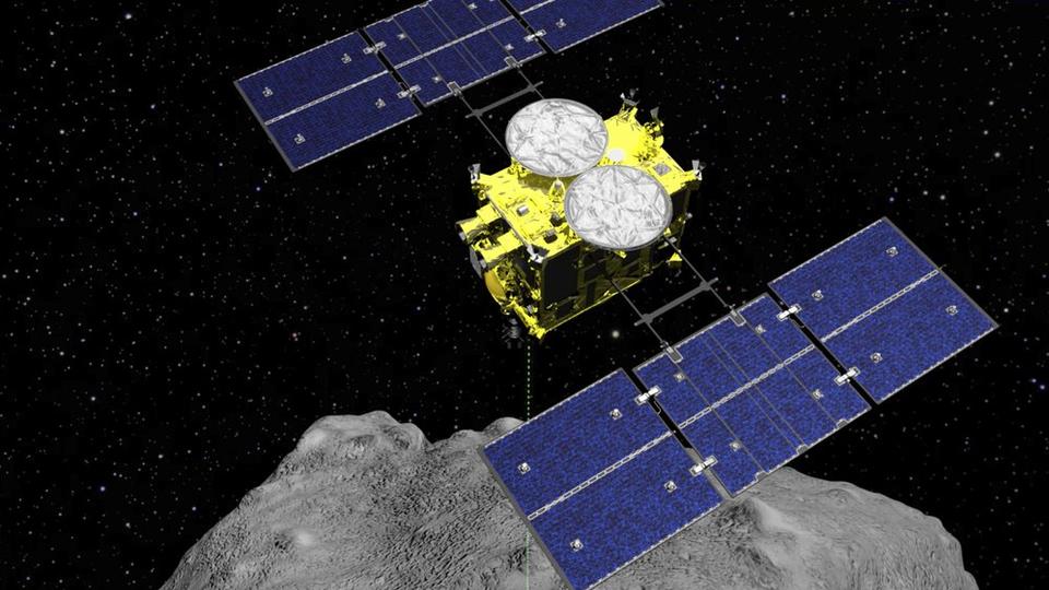This computer graphics image released by the Japan Aerospace Exploration Agency shows the Hayabusa2 spacecraft above the asteroid Ryugu.