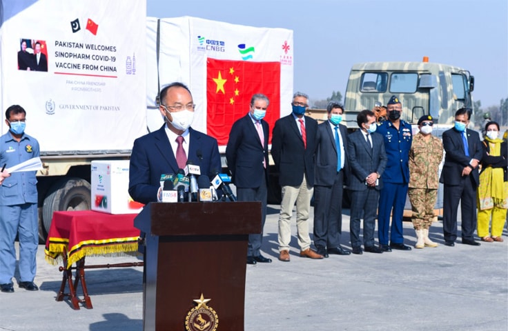 ISLAMABAD: Chinese Ambassador Nong Rong speaks at a ceremony held for handing over the first batch of Chinese vaccine to Pakistan at Nur Khan Airbase on Monday. Foreign Minister Shah Mahmood Qureshi also attended the ceremony.—White Star