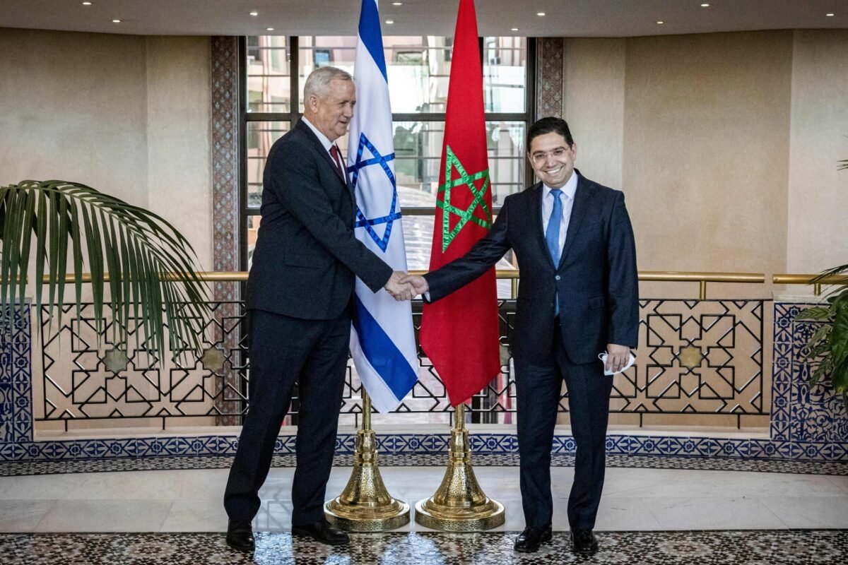 Morocco's Foreign Minister Nasser Bourita (R) shakes hands with Israel's Defence Minister Benny Gantz (L) in the capital Rabat on November 24, 2021 [FADEL SENNA/AFP via Getty Images]