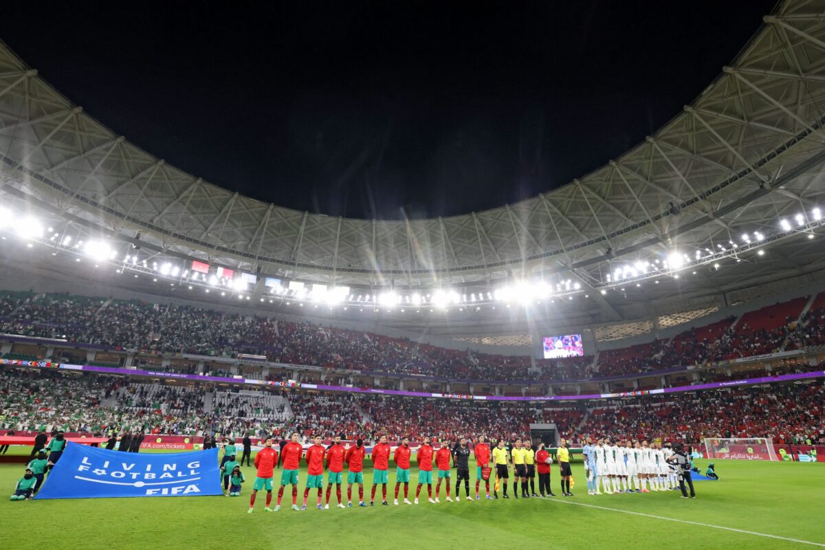 Players line up for national anthems ahead of the FIFA Arab Cup 2021 quarter final football match between Morocco and Algeria at the Al-Thumama Stadium in the Qatari capital Doha on December 11, 2021 [KARIM SAHIB/AFP via Getty Images]