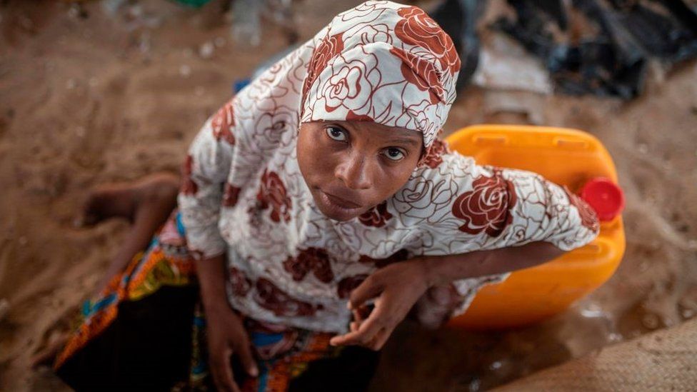32-year-old displaced Fariba Maurabu is sitting on December 8, 2020 with other displaced families who arrived 3 months ago on the beaches of Paquitequete in the city of Pemba, after armed insurgents occupied Mocimboa da Praia