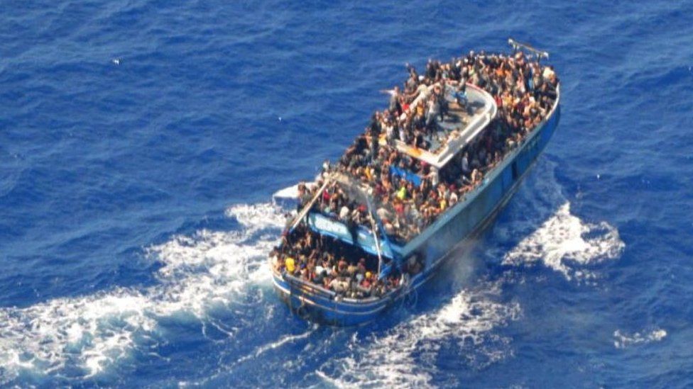 An undated photo provided by the Greek coastguard shows migrants on board a boat during a rescue operation before the boat capsized on the open sea, off Greece, June 14, 2023