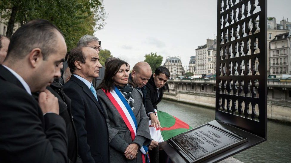 Mayor of Paris Anne Hidalgo (C) and the Secretary General of the Algerian Ministry of Foreign Affairs, Rachid Bladehane (2nd L) attend a ceremony on the banks of the Seine in Paris for the unveiling of a commemorative plate dedicated to the victims of the police repression of several hundred Algerians who demonstrated on 17 October 1961 against a curfew imposed them - 17 October 2019