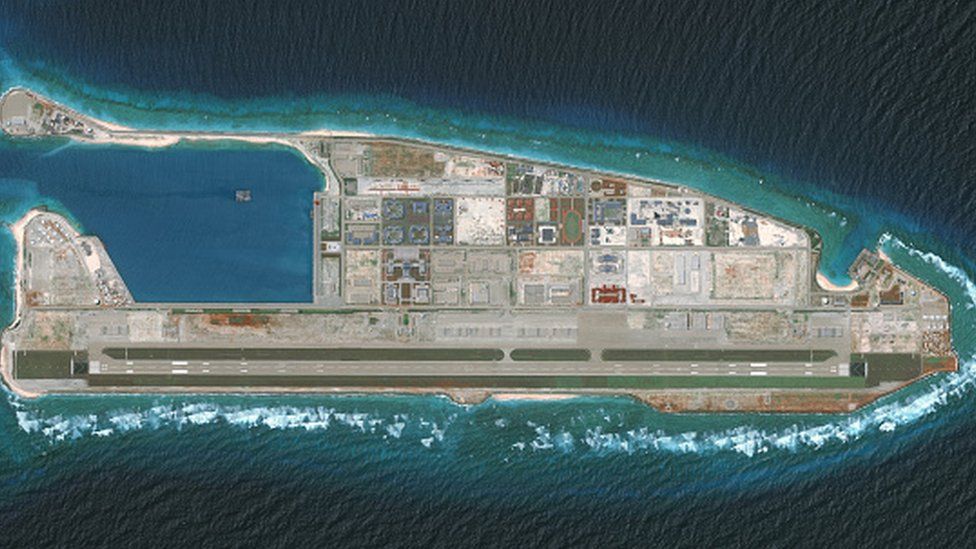 An overview satellite image shows construction by the Chinese on the Firey Cross Reef