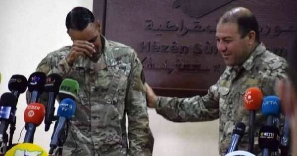 Operation Inherent Resolve Spokesman Col. Myles B. Caggins III cries during a news conference in this CCTV image captured from video