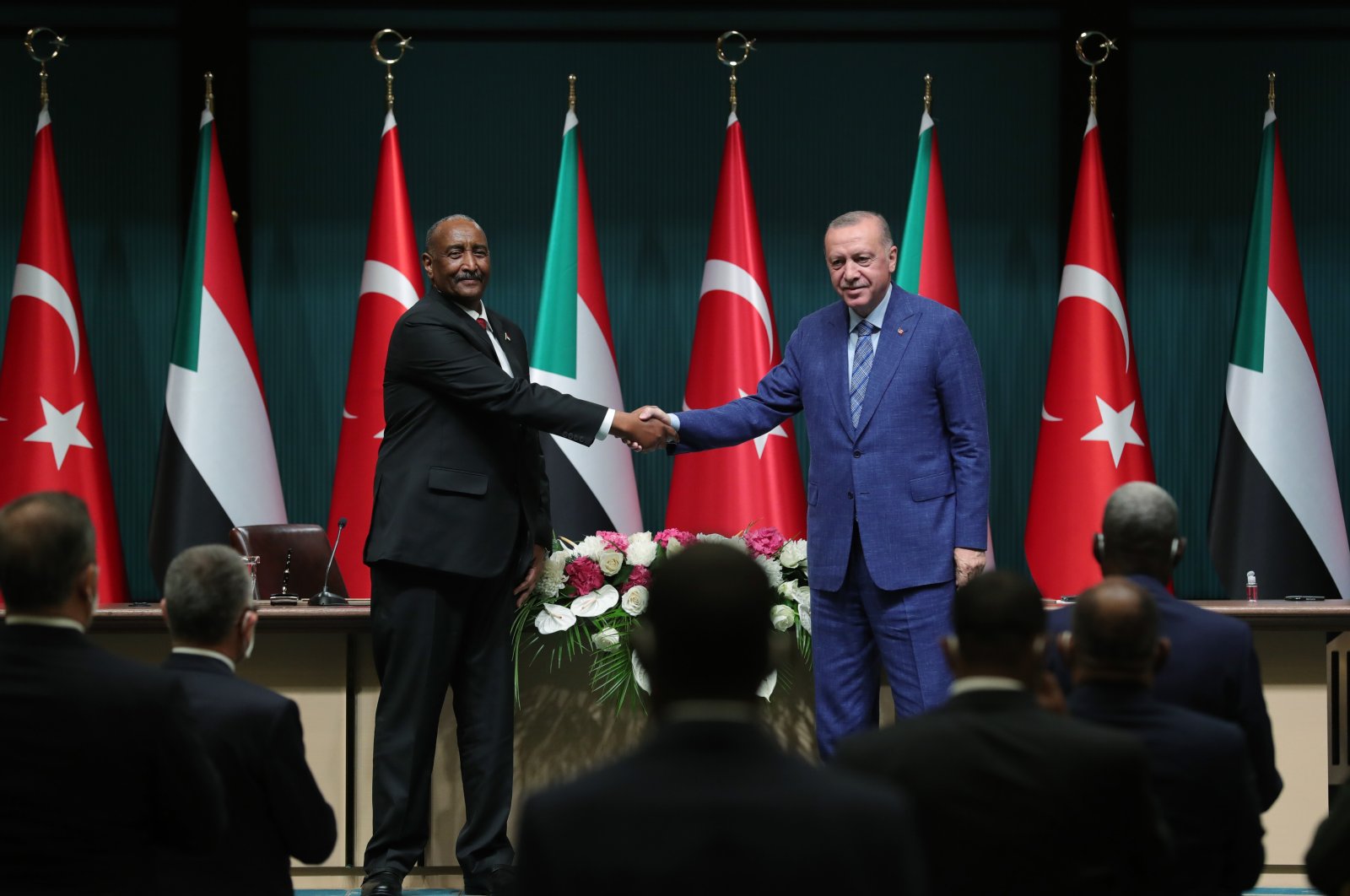President Recep Tayyip Erdoğan (R) shakes hands with Abdel Fattah al-Burhan, the chairperson of Sudan’s Sovereign Council, following their meeting in the capital Ankara, Turkey, Aug. 12, 2021. (AA Photo)