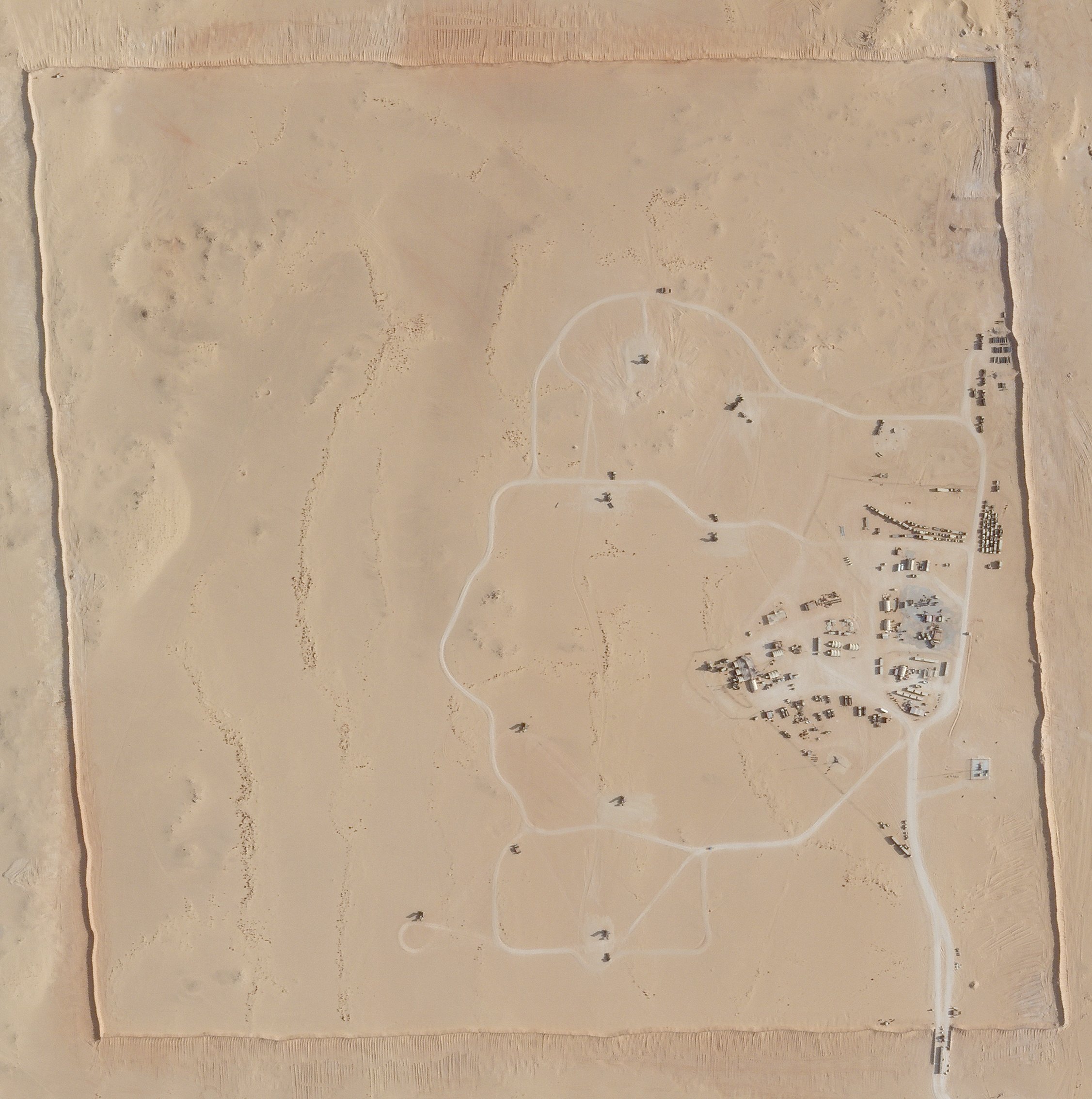 In this satellite photo provided by Planet Labs Inc., an area of Prince Sultan Air Base in Saudi Arabia sees Patriot missile batteries stationed with one advanced Terminal High Altitude Air Defense unit on Aug. 9, 2021. (Planet Labs Inc. via AP)