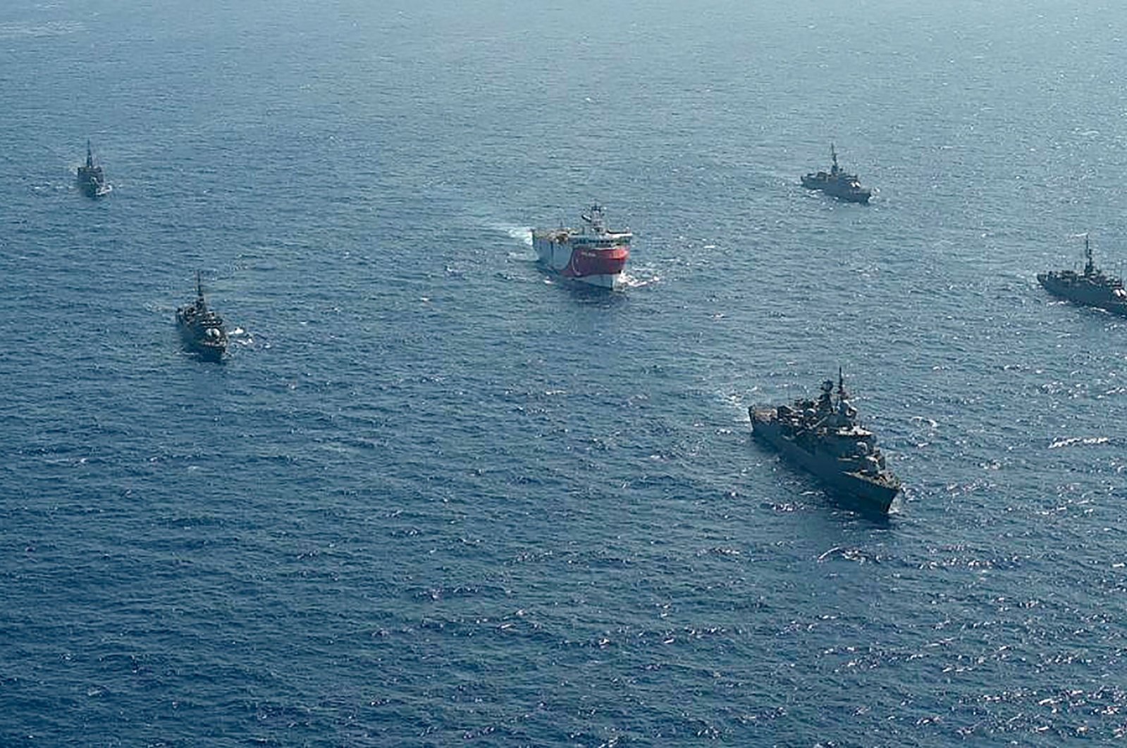This handout photograph released by the Turkish Defense Ministry shows Turkish seismic research vessel Oruc Reis (C) as it is escorted by Turkish Naval ships in the Mediterranean Sea, off Antalya, Aug. 10, 2020. (AFP File Photo)