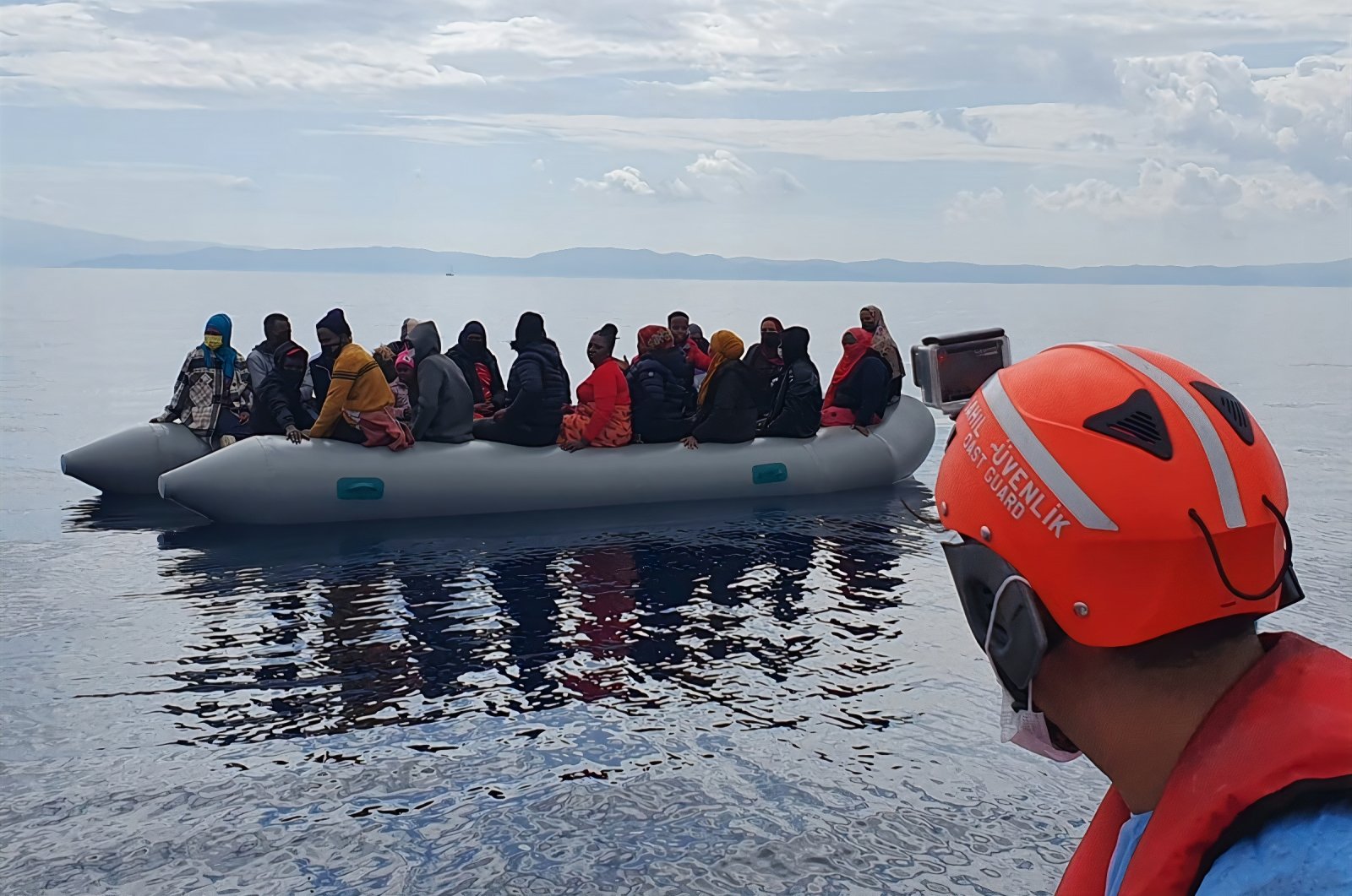 Turkish coast guard rescues irregular migrants pushed back by Greece off the coast of Dikili, Izmir, southwestern Turkey, Oct.11, 2021 (DHA Photo)