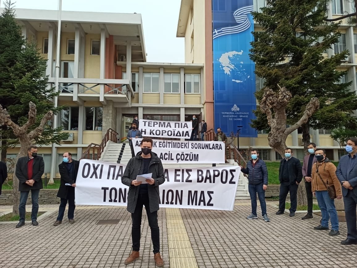Parents and their supporters take part in a demonstration protesting the Greek government's postponement of community board member elections at minority schools in Komotini (Gümülcine), northern Greece, April 6, 2021. (AA Photo)