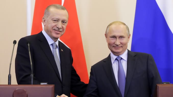 Turkey's President Recep Tayyip Erdogan (L) and Russia's President Vladimir Putin shake hands at a joint news conference on Syria following their meeting in Sochi, Russia.