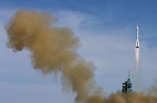 The Long March 2F rocket blasts off from the Jiuquan Satellite Launch Center in China. 