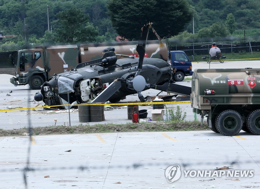 An Army ambulance helicopter is partially destroyed at an aviation battalion base in Pocheon, 46 kilometers north of Seoul, on July 12, 2021, after the aircraft crash-landed on the airstrip, leaving five people aboard injured. (Yonhap) 