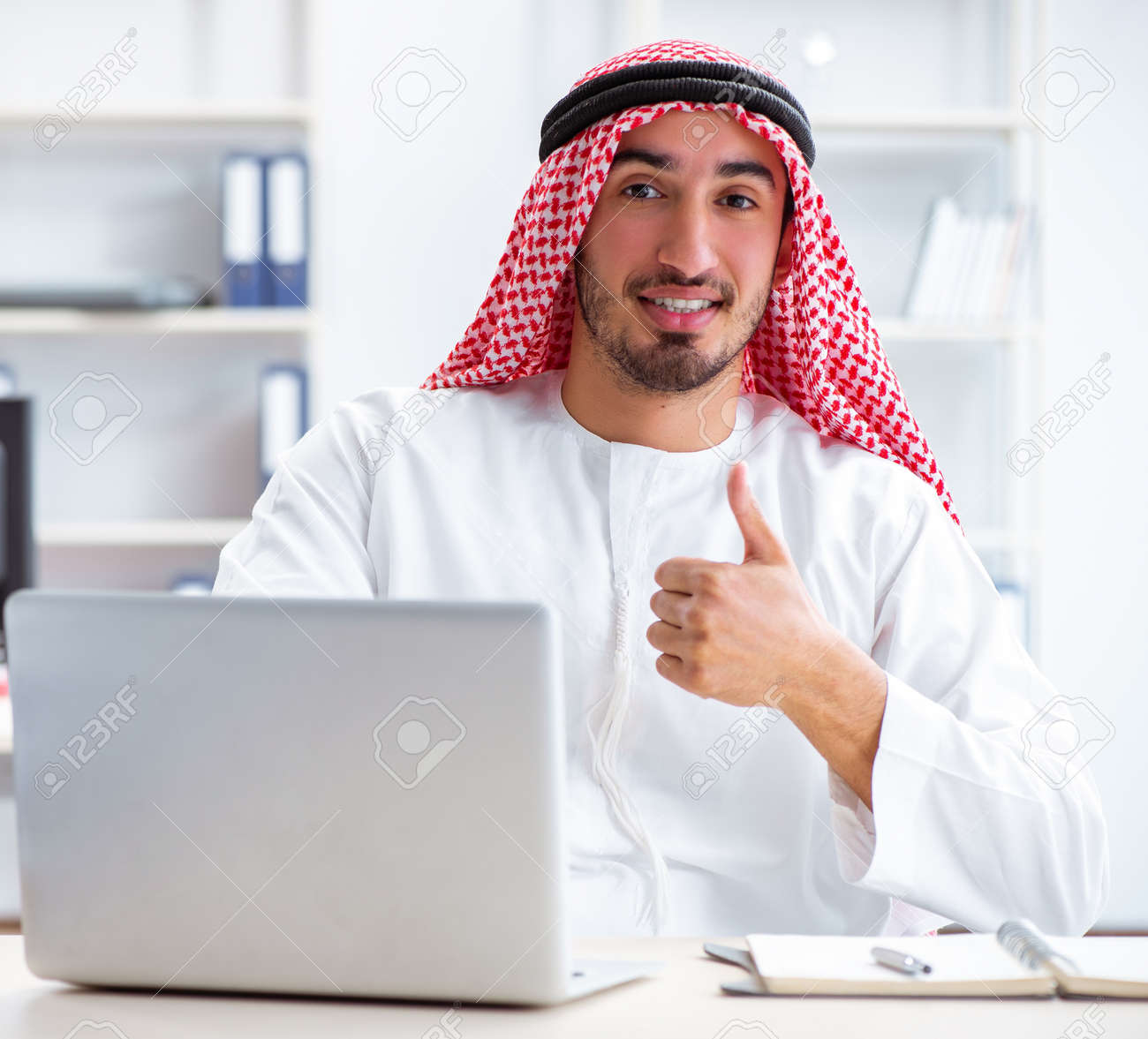 141929710-arab-businessman-working-in-the-office.jpg