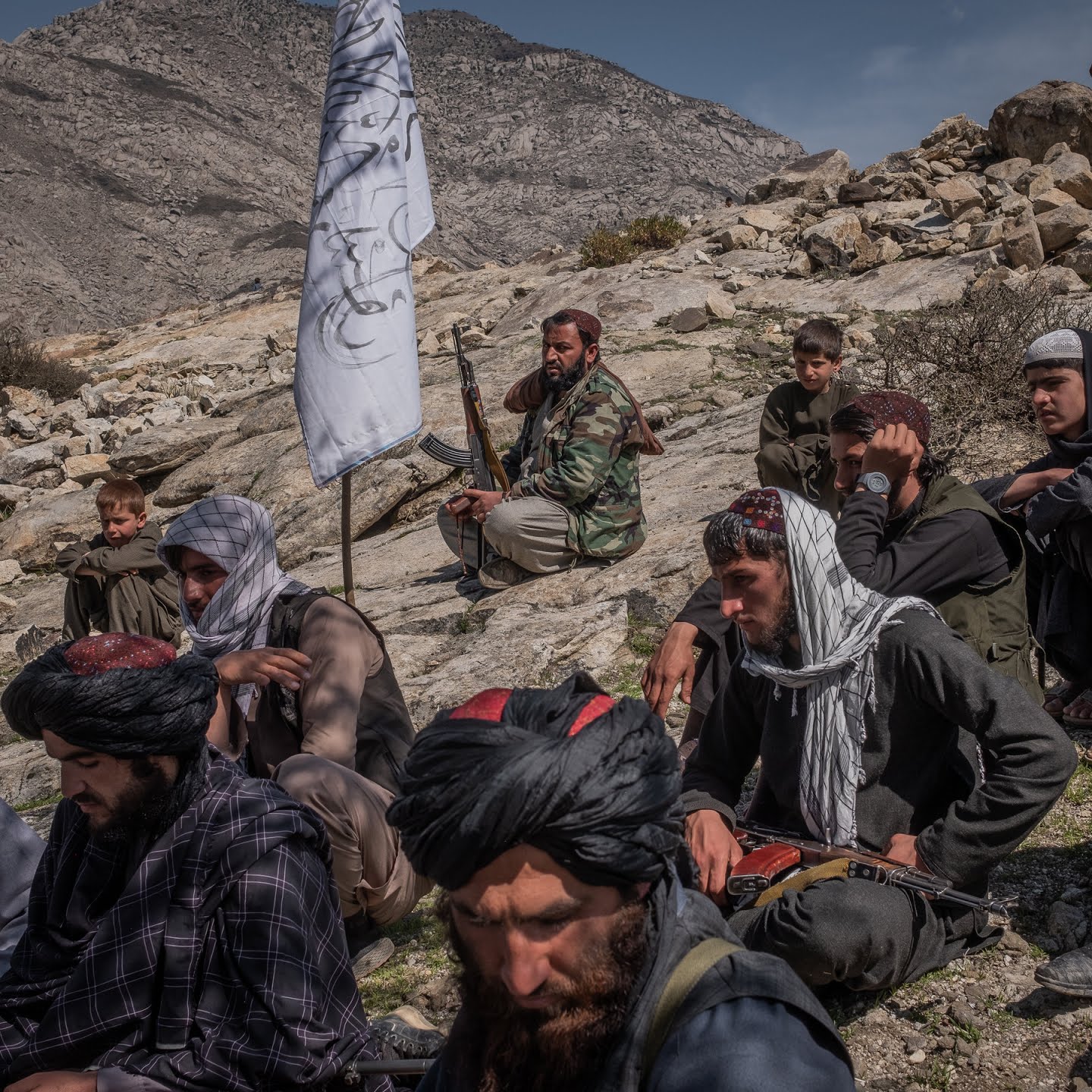 Taliban members gathered under a tree in March in Alingar District of Laghman Province, Afghanistan.