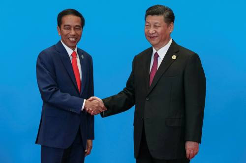 Joko Widodo, left, shakes hands with Xi Jinping at a Belt and Road forum. China has also become Indonesia’s largest trading partner 