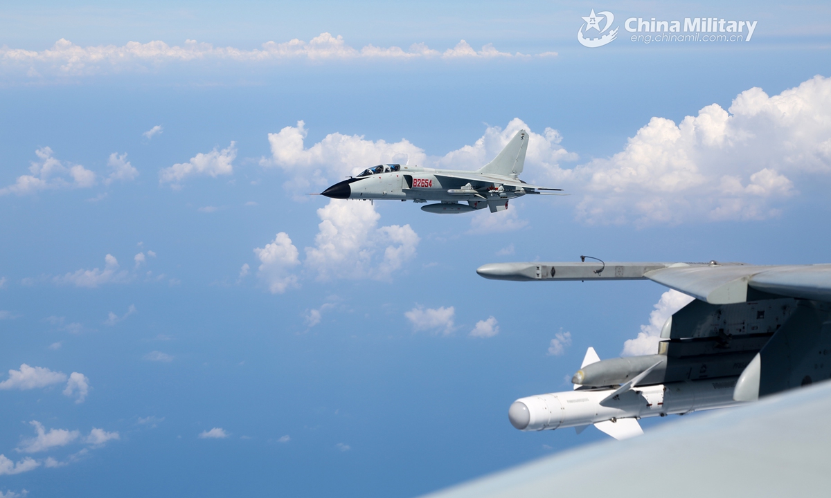 Fighter bombers attached to a naval aviation brigade under the PLA Northern Theater Command fly in line formation during a recent combat readiness patrol recently.Photo:China Military Fighter bombers attached to a naval aviation brigade under the PLA Northern Theater Command fly in line formation during a recent combat readiness patrol recently.Photo:China Military