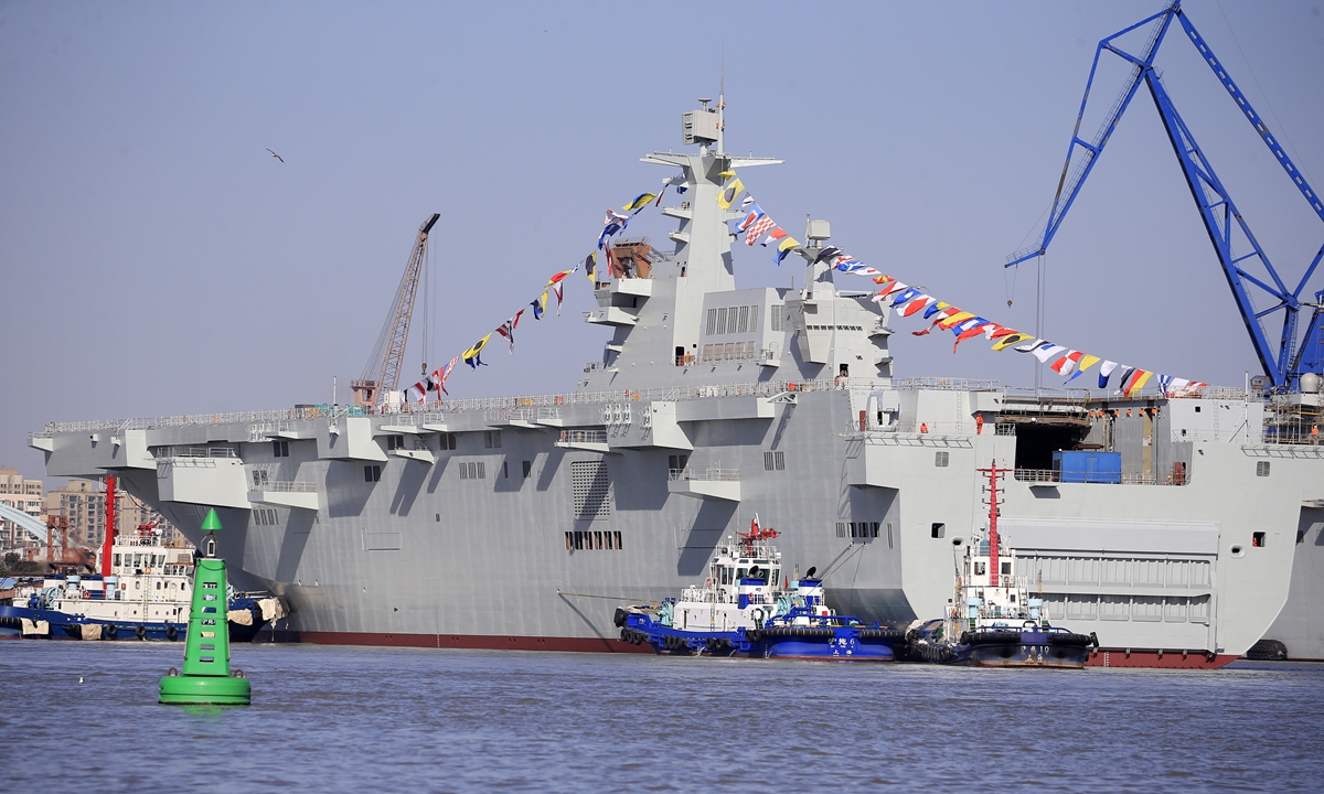 China's third Type 075 amphibious assault ship was launched from the Hudong-Zhonghua Shipyard in Shanghai on January 29, 2021. Many military enthusiasts gathered to witness the launch, and were amazed with the second and third Type 075s now both moored by the Huangpu River bank for further outfitting work. Photo: Yang Hui/GT China's third Type 075 amphibious assault ship was launched from the Hudong-Zhonghua Shipyard in Shanghai on January 29, 2021. Many military enthusiasts gathered to witness the launch, and were amazed with the second and third Type 075s now both moored by the Huangpu River bank for further outfitting work. Photo: Yang Hui/GT