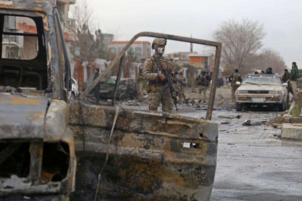 An Afghan soldier stands guard at the site of an attack in Kabul in December 2020. The number of civilian casualties in the fourth quarter of last year increased by 45% compared to the same period in 2019, according to a 23 FebruaryUN report. (Zakeria Hashimi/AFP via Getty Images)