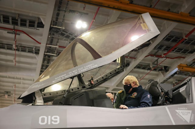 Boris Johnson pictured inside the cockpit of one of the embarked F-35 stealth jets.  Picture by Andrew Parsons / No 10 Downing Street
