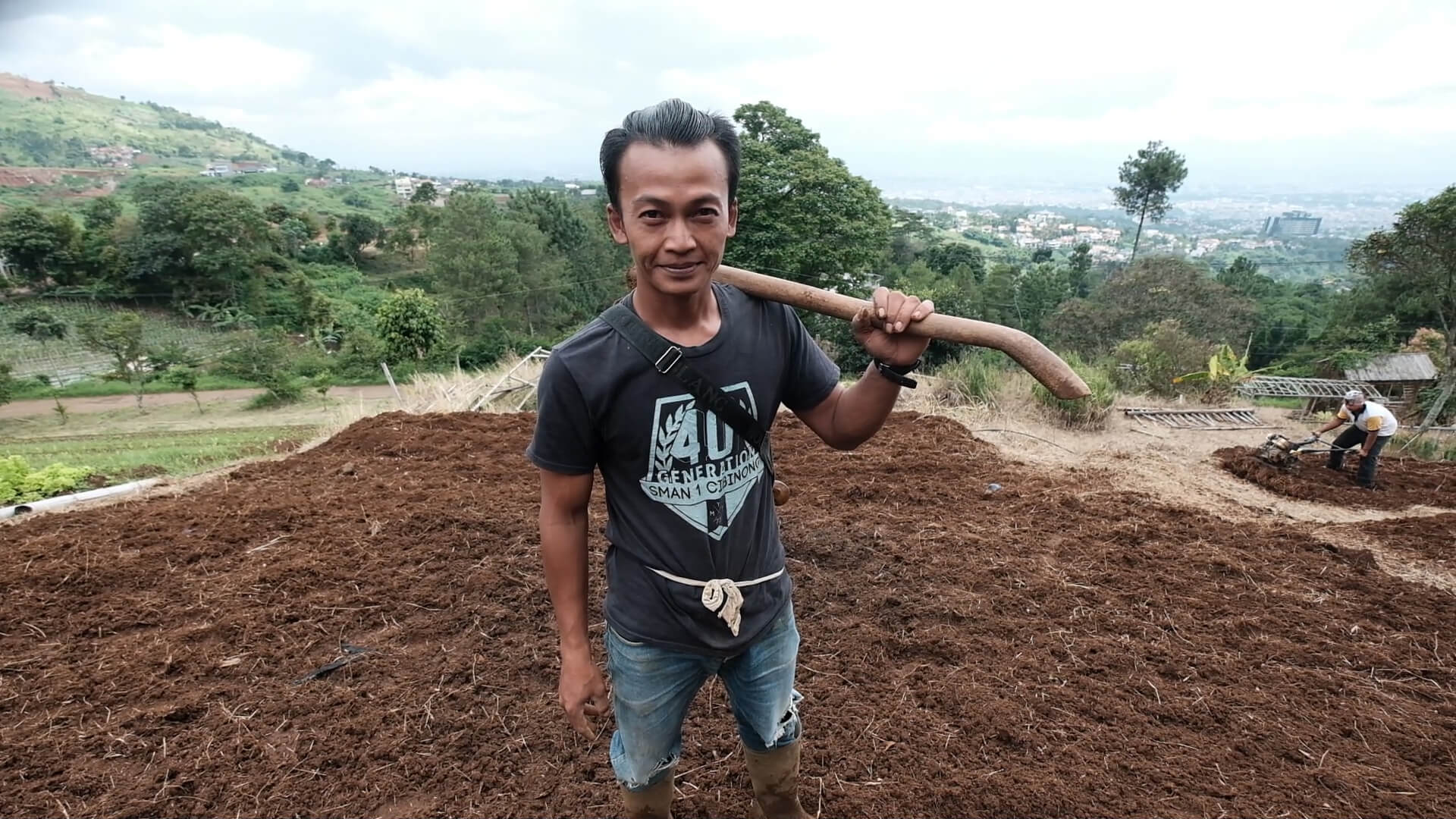 Farmer Tisna Rohmat, 33, strikes a pose in his vegetable farm in Ciburial, West Java - The Jakarta Post